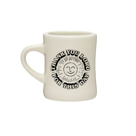 Diner mug with the lyrics "Thank You, Lord, For This Day" and a smiling sun printed it.